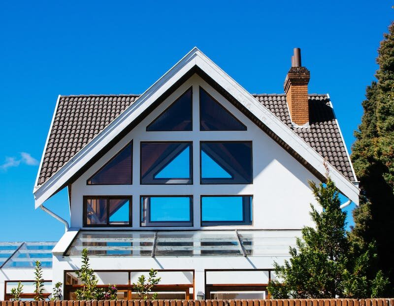 White Concrete House Under Clear Blue Sky
